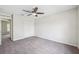 Bedroom featuring gray carpet, neutral paint and closet at 12470 Elgin Blvd, Spring Hill, FL 34609