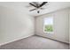 Bedroom featuring gray carpet, neutral paint and a window at 12470 Elgin Blvd, Spring Hill, FL 34609