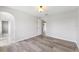 Bedroom with wood floors, a ceiling light, and doorway leading to another room at 12470 Elgin Blvd, Spring Hill, FL 34609