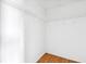 Bright, walk-in closet features metal shelving and wood flooring at 12470 Elgin Blvd, Spring Hill, FL 34609