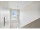 View of the foyer with a high ceiling and arch window showing the front door and stairway at 12470 Elgin Blvd, Spring Hill, FL 34609