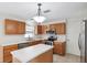 Efficient kitchen with modern appliances, an island, and lots of room for storage, making cooking easy at 12470 Elgin Blvd, Spring Hill, FL 34609