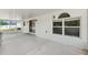 Spacious lanai featuring white stucco and a textured concrete floor at 12470 Elgin Blvd, Spring Hill, FL 34609