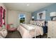 Cozy bedroom featuring a pastel color palette, natural light, and coordinated décor at 12842 Call Center Rd, Lithia, FL 33547