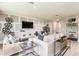 Open-concept living room showcasing modern design, comfortable seating, and wood floors at 12842 Canter Call Rd, Lithia, FL 33547