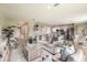 Open-concept living area showcasing modern design, comfortable seating, and a glimpse of the kitchen at 12842 Canter Call Rd, Lithia, FL 33547