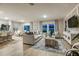 Open-concept living area showcasing modern design, comfortable seating, and an adjacent dining space at 12842 Canter Call Rd, Lithia, FL 33547