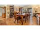 Formal dining room features beautiful hardwood floors, built-in bookcases, and sliding doors to the lanai at 14169 Fennsbury Dr, Tampa, FL 33624