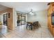 Dining room with large glass doors leading to the outdoor pool area, allowing for natural light at 14169 Fennsbury Dr, Tampa, FL 33624