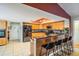 Kitchen featuring breakfast bar, granite countertops, stainless steel appliances and tile flooring at 14169 Fennsbury Dr, Tampa, FL 33624