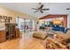 Open concept living area features sliding doors to the lanai and flows seamlessly into the kitchen at 14169 Fennsbury Dr, Tampa, FL 33624