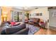 Comfortable living room with sofa, piano, colorful rug and a large window at 14169 Fennsbury Dr, Tampa, FL 33624