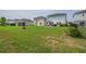 Large backyard with well-maintained lawn, gazebo, and space for outdoor activities and relaxation at 14643 Brumby Ridge Ave, Lithia, FL 33547