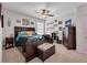 Large bedroom with queen sized bed, chest of drawers, accent lighting and decor at 14643 Brumby Ridge Ave, Lithia, FL 33547