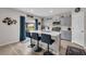 Modern kitchen featuring an island with bar seating, stainless steel appliances, and ample countertop space at 14643 Brumby Ridge Ave, Lithia, FL 33547