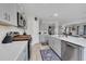 Bright kitchen featuring gray cabinets, modern appliances, and an open layout at 14643 Brumby Ridge Ave, Lithia, FL 33547