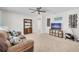 Cozy living area with comfortable seating, TV, and natural light at 14643 Brumby Ridge Ave, Lithia, FL 33547