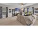 Bright and airy living room featuring comfortable seating, large windows, and stylish decor at 14643 Brumby Ridge Ave, Lithia, FL 33547