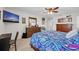 Comfortable main bedroom with a large bed and dark wood dresser at 14643 Brumby Ridge Ave, Lithia, FL 33547