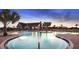 Resort-style community pool with lounge chairs and palm trees, perfect for relaxation and recreation at 14643 Brumby Ridge Ave, Lithia, FL 33547
