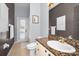 Bathroom featuring granite counters, tile flooring, with door to the patio at 1516 E Lake Woodlands Pkwy, Oldsmar, FL 34677
