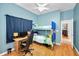 Comfortable bedroom designed with bunk beds, study space, and a cozy atmosphere at 1516 E Lake Woodlands Pkwy, Oldsmar, FL 34677