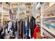 Walk-in closet with custom shelving, ample storage for clothes and accessories at 1516 E Lake Woodlands Pkwy, Oldsmar, FL 34677