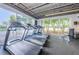 Modern gym equipped with treadmills and large windows, offering a refreshing view during workouts at 1516 E Lake Woodlands Pkwy, Oldsmar, FL 34677