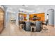 Spacious kitchen with a center island, wooden cabinets and tile flooring, ideal for Gathering gatherings at 1516 E Lake Woodlands Pkwy, Oldsmar, FL 34677