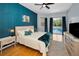 Spacious main bedroom boasts a king bed and sliding doors to the pool at 1516 E Lake Woodlands Pkwy, Oldsmar, FL 34677