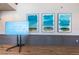 Modern wall art displayed near a TV screen and gray wainscoting at 1516 E Lake Woodlands Pkwy, Oldsmar, FL 34677