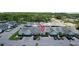 Birds-eye view of townhomes with neatly arranged parking, green spaces, and a community setting at 16109 Rambling Vine E Dr, Tampa, FL 33624