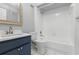Bathroom featuring vanity with a sink and a shower-tub combo at 16109 Rambling Vine E Dr, Tampa, FL 33624
