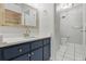 Well-lit bathroom featuring a vanity with a sink and a toilet at 16109 Rambling Vine E Dr, Tampa, FL 33624