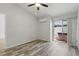 Bedroom featuring sliding glass doors to a private patio with a hot tub at 16109 Rambling Vine E Dr, Tampa, FL 33624