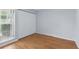 Cozy bedroom with a large window and a closet with folding doors at 16109 Rambling Vine E Dr, Tampa, FL 33624