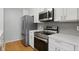 Updated kitchen featuring stainless steel appliances and ample counter space at 16109 Rambling Vine E Dr, Tampa, FL 33624