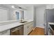 Updated kitchen with stainless steel appliances and breakfast bar at 16109 Rambling Vine E Dr, Tampa, FL 33624