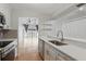 Modern kitchen with stainless appliances overlooking the living area and backyard at 16109 Rambling Vine E Dr, Tampa, FL 33624