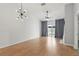 Spacious living room with ample natural light and modern lighting fixture at 16109 Rambling Vine E Dr, Tampa, FL 33624