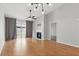 Bright living room with hardwood floors, a fireplace, and sliding glass doors at 16109 Rambling Vine E Dr, Tampa, FL 33624
