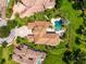 Aerial view showcases the home's sprawling layout, pool area, and well-manicured landscaping at 17301 Ladera Estates Blvd, Lutz, FL 33548