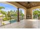 Enjoy stunning views from this spacious balcony, complete with a cozy fireplace and lush landscaping at 17301 Ladera Estates Blvd, Lutz, FL 33548