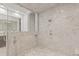 Luxurious all-marble shower with glass door at 17301 Ladera Estates Blvd, Lutz, FL 33548