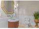 Powder room with elegant mirror, custom vanity, and stylish fixtures at 17301 Ladera Estates Blvd, Lutz, FL 33548