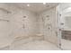 Luxurious all-marble shower with dual shower heads and built-in bench at 17301 Ladera Estates Blvd, Lutz, FL 33548