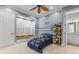 Bedroom featuring a window seat, blue walls, neutral carpet, and a ceiling fan at 17301 Ladera Estates Blvd, Lutz, FL 33548