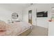 Cozy bedroom features plush carpet, a stylish vanity, a TV, and ample natural light at 17301 Ladera Estates Blvd, Lutz, FL 33548