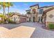 Elegant two-story home with a tile roof, paver driveway, and attached garage at 17301 Ladera Estates Blvd, Lutz, FL 33548