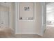 Hallway featuring a built-in display shelf and neutral paint at 17301 Ladera Estates Blvd, Lutz, FL 33548